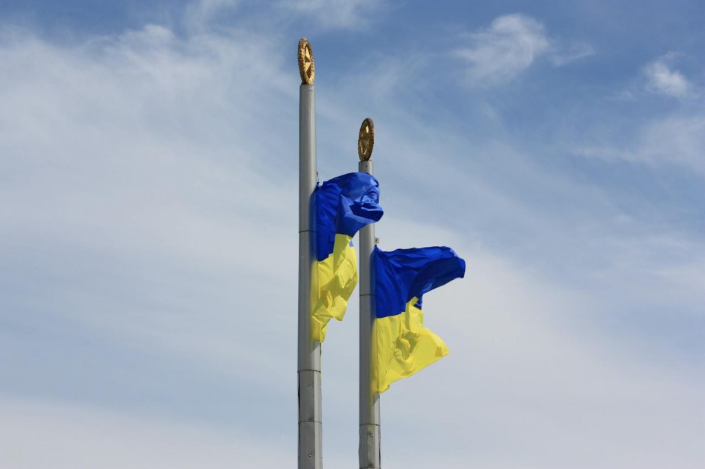 cloudy sky over swaying flags